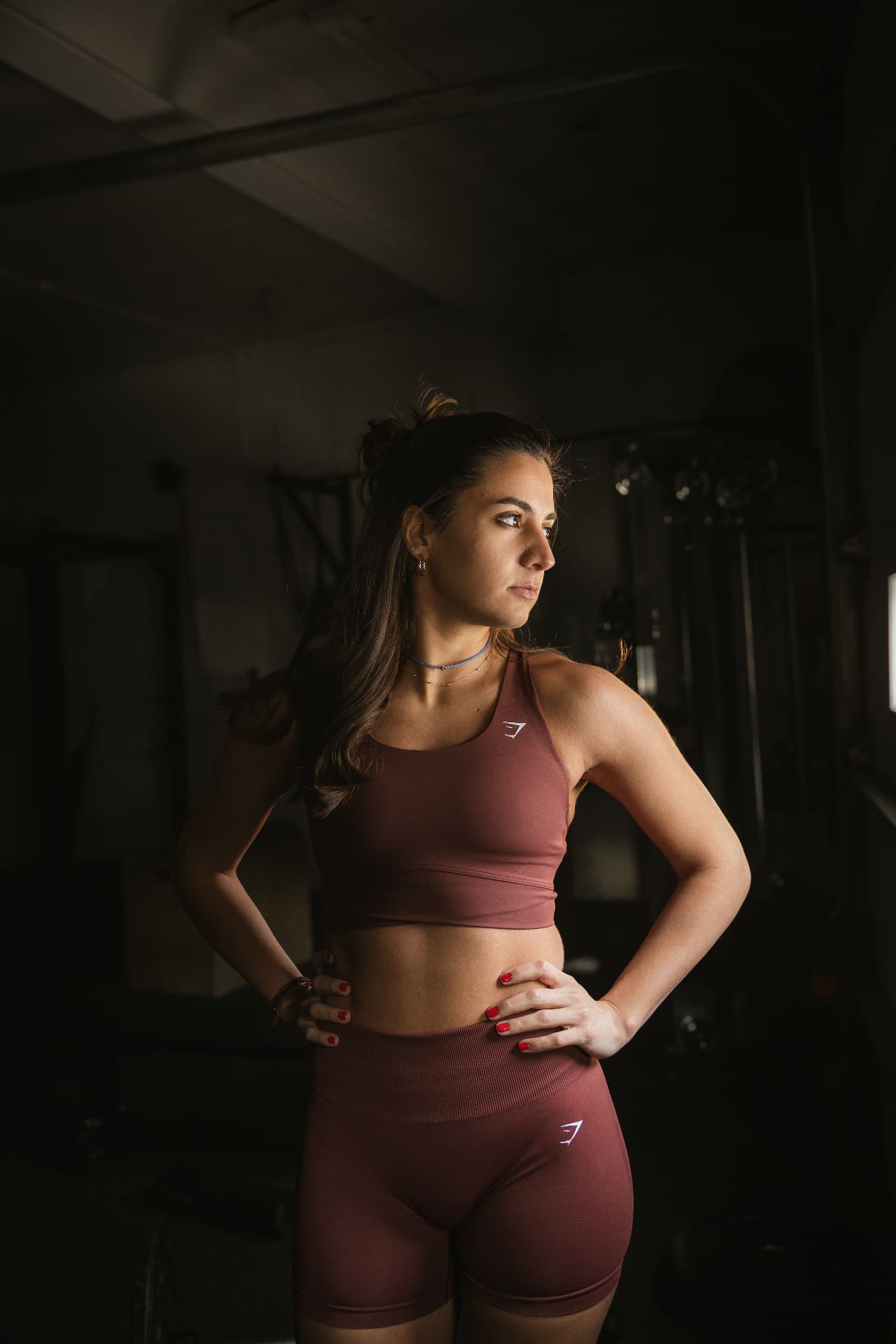 Carine, personal trainer, standing in the gym